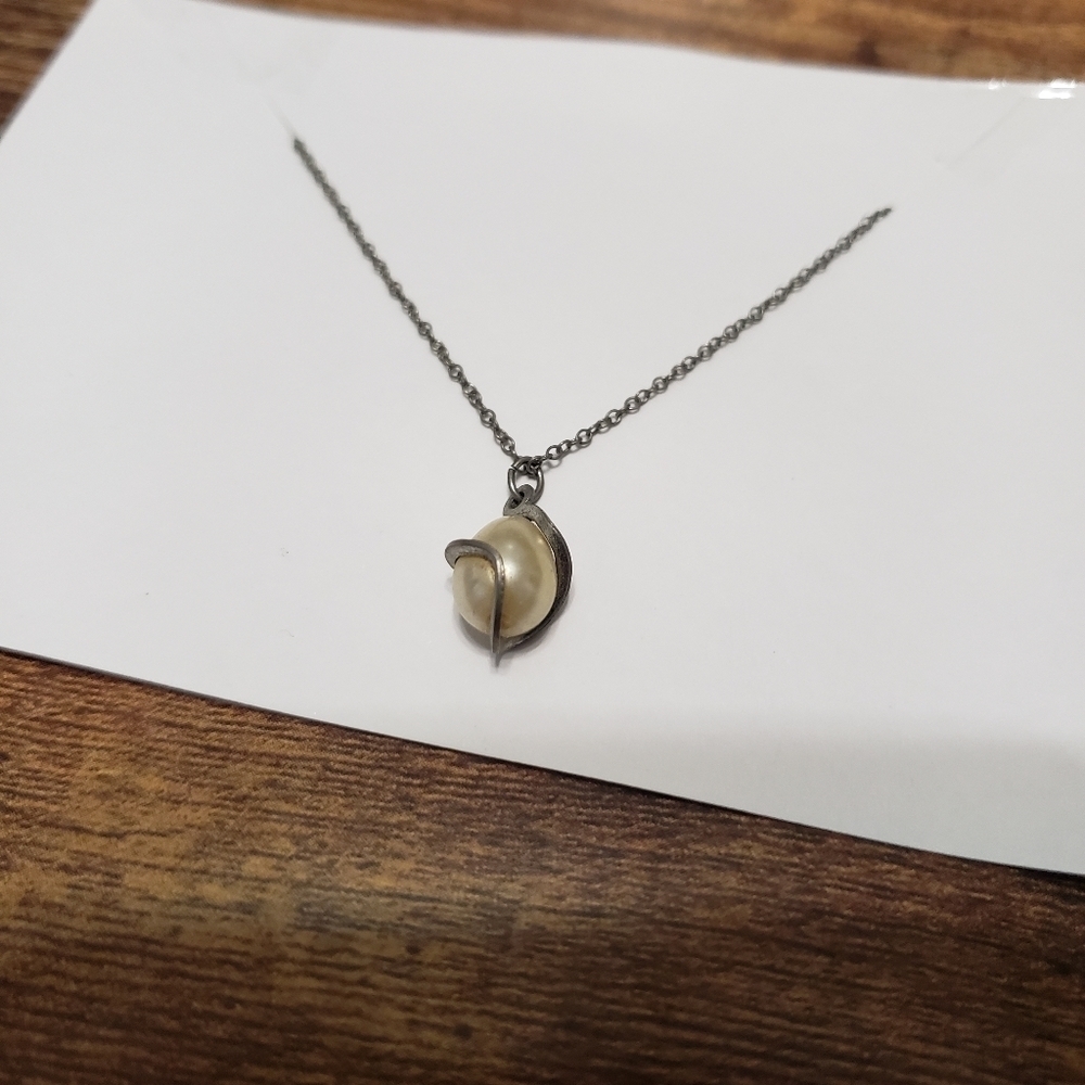 silver tone necklace with pearl gem